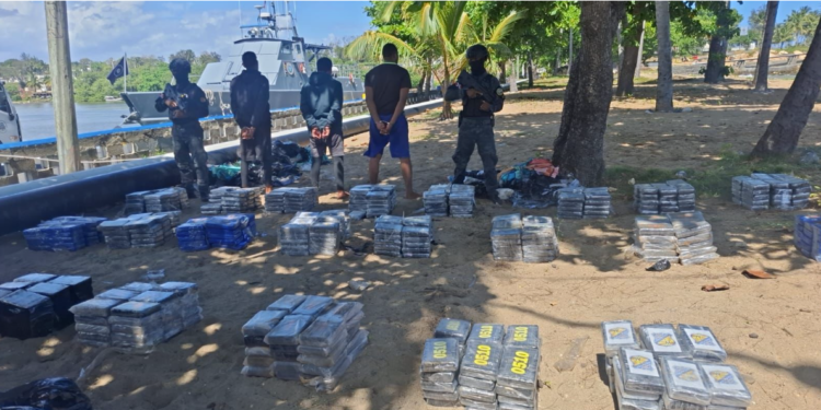 In the foreground are quantities of drugs seized during the operation (Photo via CARICOMIMPACS)