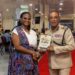 CEO Outliers Zone Caribbean & Commissioner of Police Cliffon Hicken with the Financial Readiness Manual for disciplined services