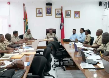 The Guyana Police Force and Environmental Protection Agency during a recent consultation (photo) Guyana Chronicle