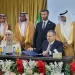 Members of the consortium of Saudi and international private investors pose with ILO's Maha Kattaa, the Ministry of Energy's Ousama Abo Zaid (standing), and Herafi's Ibrahim Al-Ameer (seated) at a public-private renewable energy event, in Damascus, August (ILO photo)