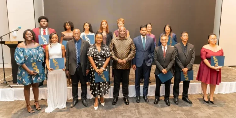 Prime Minister, Brigadier (Ret’d) Mark Phillips, along with Minister of Culture, Youth and Sports, Charles Ransom with awardees