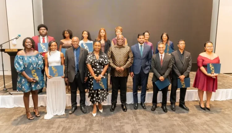 Prime Minister, Brigadier (Ret’d) Mark Phillips, along with Minister of Culture, Youth and Sports, Charles Ransom with awardees