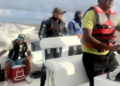 Opposition Leader Azruddin Mohamed (second left) in the boats seized by authorities