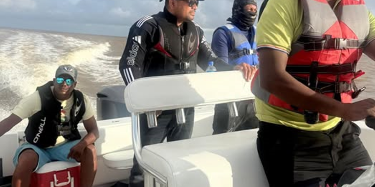 Opposition Leader Azruddin Mohamed (second left) in the boats seized by authorities