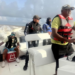 Opposition Leader Azruddin Mohamed (second left) in the boats seized by authorities