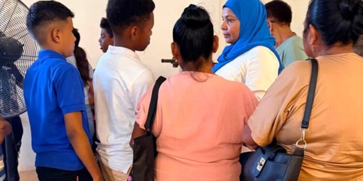 MP Natasha Singh (blue hijab) engaging residents in Region One during her days-long visit last week