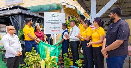 Official unveiling of the Skeldon Line Path Secondary School EcoHub signage by representatives of Recover Guyana, ExxonMobil Guyana, the Ministry of Education, REO Region Six and the school’s Headteacher