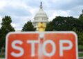 This photo, taken on Aug. 28, 2026, shows a stop sign with the U.S. Capitol building in the background in Washington, D.C., the United States. (Xinhua/Li Rui)