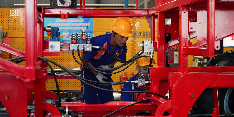 A worker assembles agricultural machinery at Heilongjiang Dewo Technology Development Co., Ltd. in Harbin, Heilongjiang Province, China, September 1, 2026. /VCG