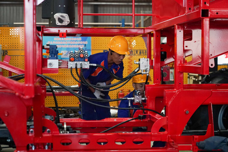A worker assembles agricultural machinery at Heilongjiang Dewo Technology Development Co., Ltd. in Harbin, Heilongjiang Province, China, September 1, 2026. /VCG