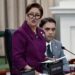 fighting against crime: Prime Minister Kamla Persad-Bissessar delivers a statement during yesterday’s sitting of Parliament. At right is Public Utilities Minister Barry Padarath. —Photo: JERMAINE CRUICKSHANK