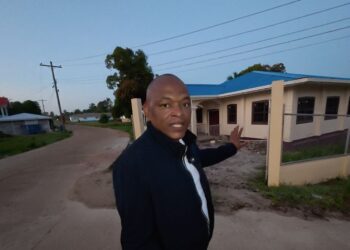 MP Sherod Duncan pointing to the shuttered Mabaruma Health Centre