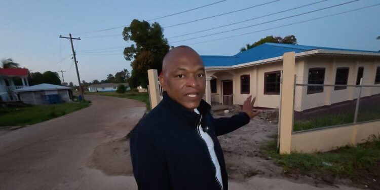 MP Sherod Duncan pointing to the shuttered Mabaruma Health Centre