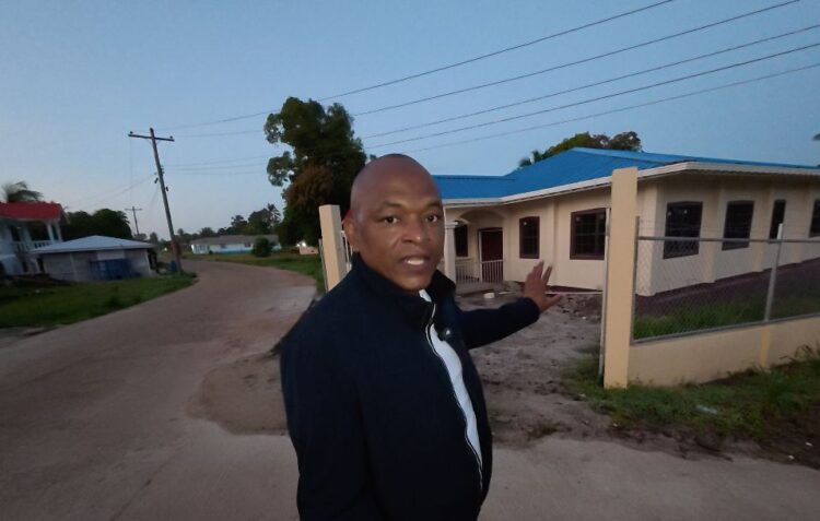 MP Sherod Duncan pointing to the shuttered Mabaruma Health Centre