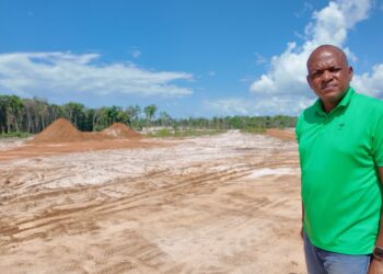 Sherod Duncan MP (APNU) standing in front the site of the proposed Mahdia Housing Developmeent