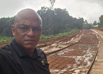MP Sherod Duncan standing in front of the Santa Rosa-Kwebanna corridor in Region One (MP Duncan's photo)