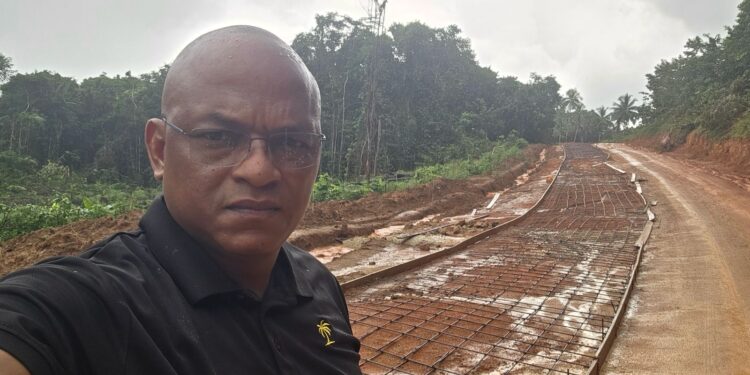 MP Sherod Duncan standing in front of the Santa Rosa-Kwebanna corridor in Region One (MP Duncan's photo)