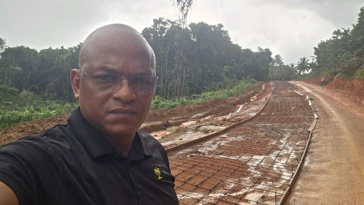 MP Sherod Duncan standing in front of the Santa Rosa-Kwebanna corridor in Region One (MP Duncan's photo)