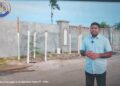 Opposition Leader Azruddin Mohamed standing in front of the wall at Leonora, West Coast Demerara (screen grab photo)