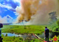 GDF helicopter conducts aerial water drops over the savannah fire near Moblissa Ranch along the Soesdyke-Linden Highway