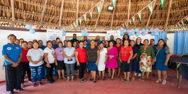 Representatives from the Greater Guyana Initiative, Food for the Poor (Guyana) Inc. and some of the beneficiaries of Project ANAIM