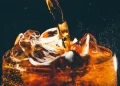 A recent study has linked daily sugary beverage consumption to a higher risk of gastric cancer.
Credit: Maria Korneeva / Getty Images