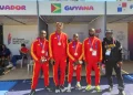 4x100m team: Onesi Dunn, Revon Williams, Akeem Stewart, and Shamar Horatio along with coach Mark Scott
