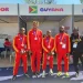 4x100m team: Onesi Dunn, Revon Williams, Akeem Stewart, and Shamar Horatio along with coach Mark Scott