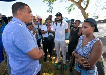 Photo: YHOMO HUTCHINSON
Prime Minister, Dr. the Most Hon. Andrew Holness (left) engages with residents of the Cooper's Pen community in Trelawny on Friday (August 28).