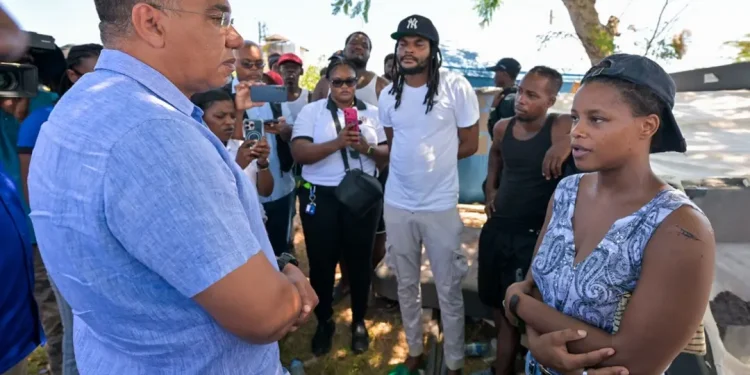 Photo: YHOMO HUTCHINSON
Prime Minister, Dr. the Most Hon. Andrew Holness (left) engages with residents of the Cooper's Pen community in Trelawny on Friday (August 28).