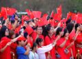 People watch a performance after attending a flag-raising ceremony at Dongfeng Square in Kunming, southwest China's Yunnan Province, Oct. 1, 2026. (Photo by Zheng Yi/Xinhua)