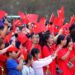 People watch a performance after attending a flag-raising ceremony at Dongfeng Square in Kunming, southwest China's Yunnan Province, Oct. 1, 2026. (Photo by Zheng Yi/Xinhua)