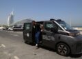 This photo taken on June 7, 2026 shows a China-made self-driving taxi near the Burj Al Arab hotel in Dubai, the United Arab Emirates. (Xinhua/Wen Xinnian)