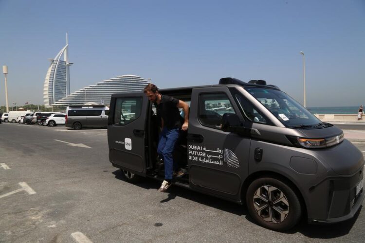 This photo taken on June 7, 2026 shows a China-made self-driving taxi near the Burj Al Arab hotel in Dubai, the United Arab Emirates. (Xinhua/Wen Xinnian)