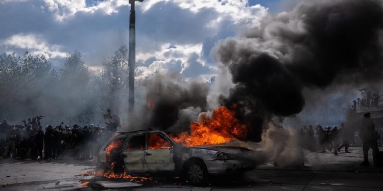 Photo taken on Oct. 17, 2026 shows a burning vehicle during a protest in Paris, France. (Photo by Aurelien Morissard/Xinhua)