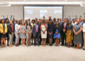 fLASHBACK | Anguilla's Chief Statistician, Ms. Lori-Rae Alleyne-Franklin (centre) with other delegates at the 50th Meeting of the SCCS in Curacao last year