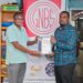 GNBS Head of Certification Services (ag), Keon Rankin, handing over the certificate to Deputy Factory Manager at Gafsons Industries, Jitendra Mishrah