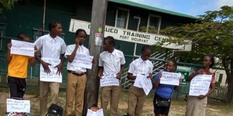 Corentyne Comprehensive High School holding placards this morning on the matter of male students. October 2, 2026