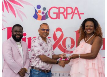 GGI Lead, Alicia Bess-Anderson accepting the award from the Honourable Dr. Frank Anthony, Minister of Health in the presence of Executive Director of the Guyana Responsible Parenthood Association (GRPA), Kobe Smith.