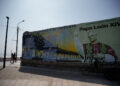 People walk past a mural dedicated to Pope Leo on the oceanfront boardwalk overlooking the Pacific Ocean, as Peruvians remember Pope Leo as a migrant priest who helped feed hungry families, delivered aid after floods and walked alongside refugees during his years in Peru, ahead of his November... Purchase Licensing Rights