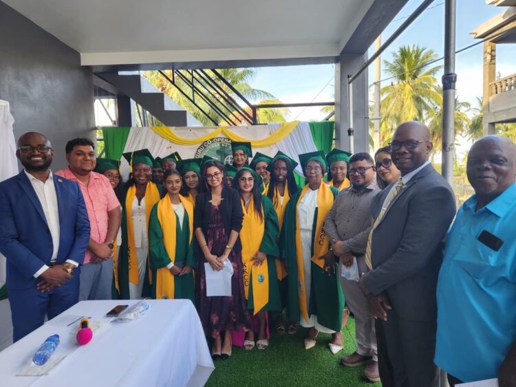 Photo caption: From left, Dr. Kofi Dalrymple and Mahaicony/Abary NDC Vice Chairman Mr. Leon Wordsworth, with the graduates and lecturer Ms. Chandradai Devina Persaud, Regional Chairman Mr. Recardo Phillips, Regional Executive Officer Ms. Mary Samaroo, Mr. Hansen Elliot, Principal of the Kuru Kuru Cooperative College and Mr. Matthews representative of Kuru Kuru College
