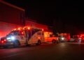 Emergency crews and military personnel gather at the Wainwright Health Centre as injured military members are treated after a fire at Canadian Forces Base Wainwright, outside of Wainwright, Alberta Saturday, Oct. 17, 2026. (John Ulan/The Canadian Press via AP)
