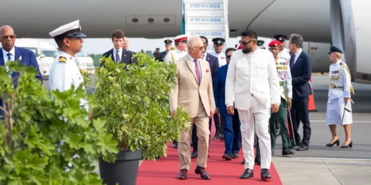 President Dr Mohamed Irfaan Ali engages His Majesty King Charles III following his arrival (DPI photo)