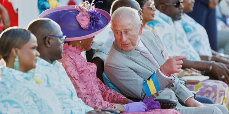 Britain’s King Charles III chats with Governor General of The Bahamas Cynthia Pratt at The Future Bahamas Youth Rally and Exhibition at Clifford Park in Nassau, Bahamas, Tuesday, Oct. 27, 2026. (AP Photo/Tim Aylen) License this photo
