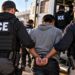 ICE agents began appearing at major US airports in force from March 2026, targeting foreign nationals with expired visas — a dramatic expansion from the previous practice of only detaining those with existing removal orders.