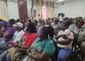 Families and supporters of the MV Barima tragedy attending the Commissioners COI meeting October 7, 2026 at Arthur Chung Convention (Kyon Brown's mother sitting in front row in red t-shirt)
