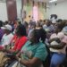 Families and supporters of the MV Barima tragedy attending the Commissioners COI meeting October 7, 2026 at Arthur Chung Convention (Kyon Brown's mother sitting in front row in red t-shirt)